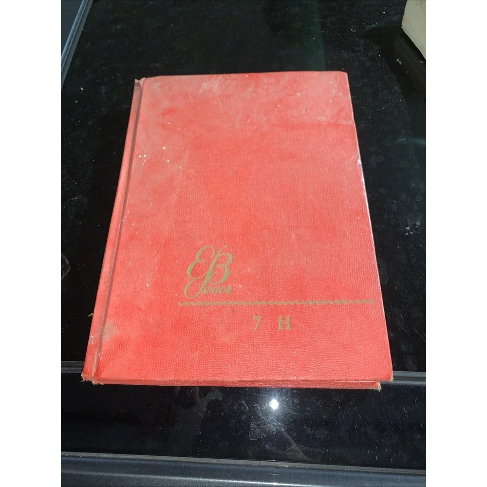 Volume 7 (H) of the vintage red and gold Britannica Junior Encyclopædia
